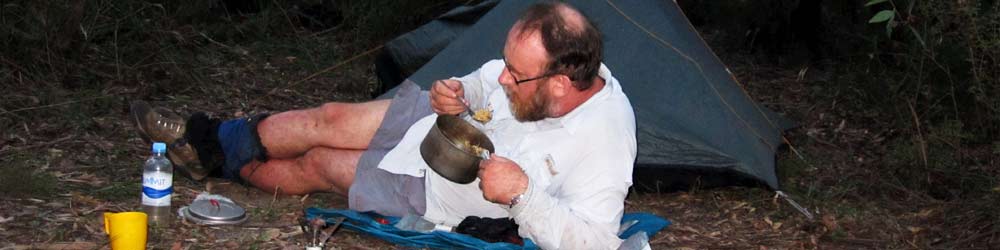 bushwalker enjoying a meal on a camping trip